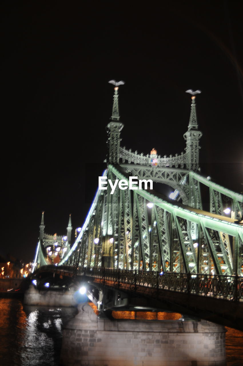 ILLUMINATED SUSPENSION BRIDGE AGAINST SKY