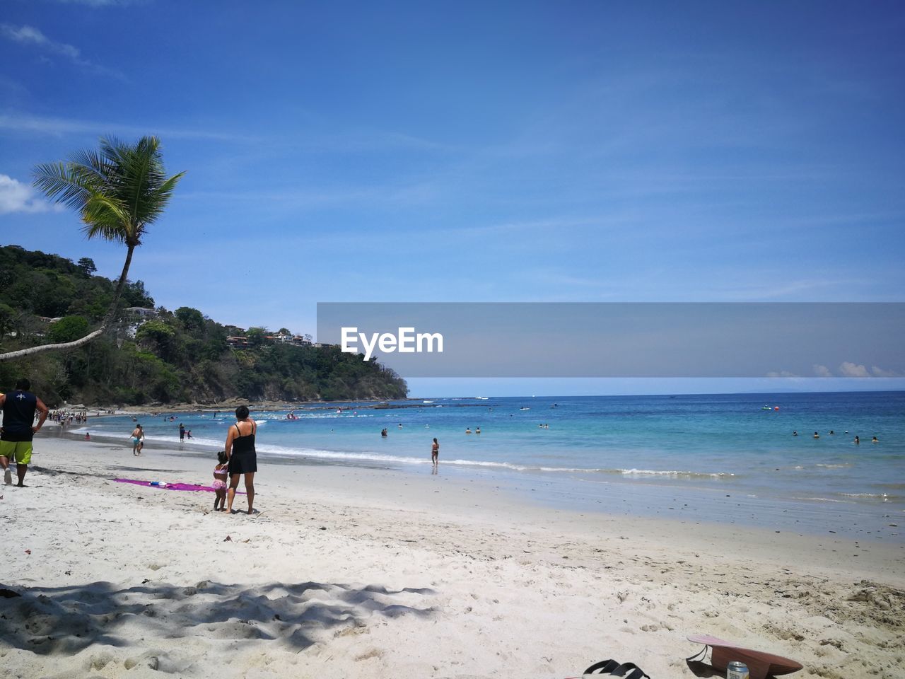 SCENIC VIEW OF PEOPLE ON BEACH