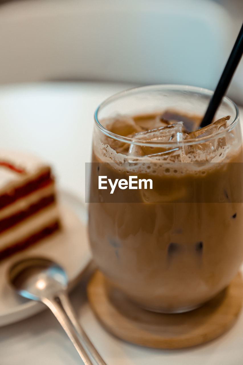 CLOSE-UP OF COFFEE CUP ON TABLE