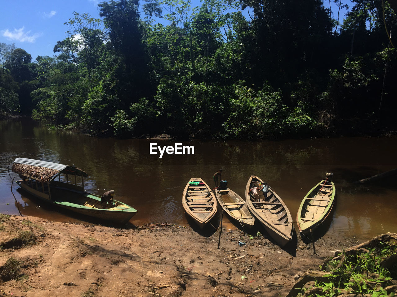 High angle view of people in boats moored on river