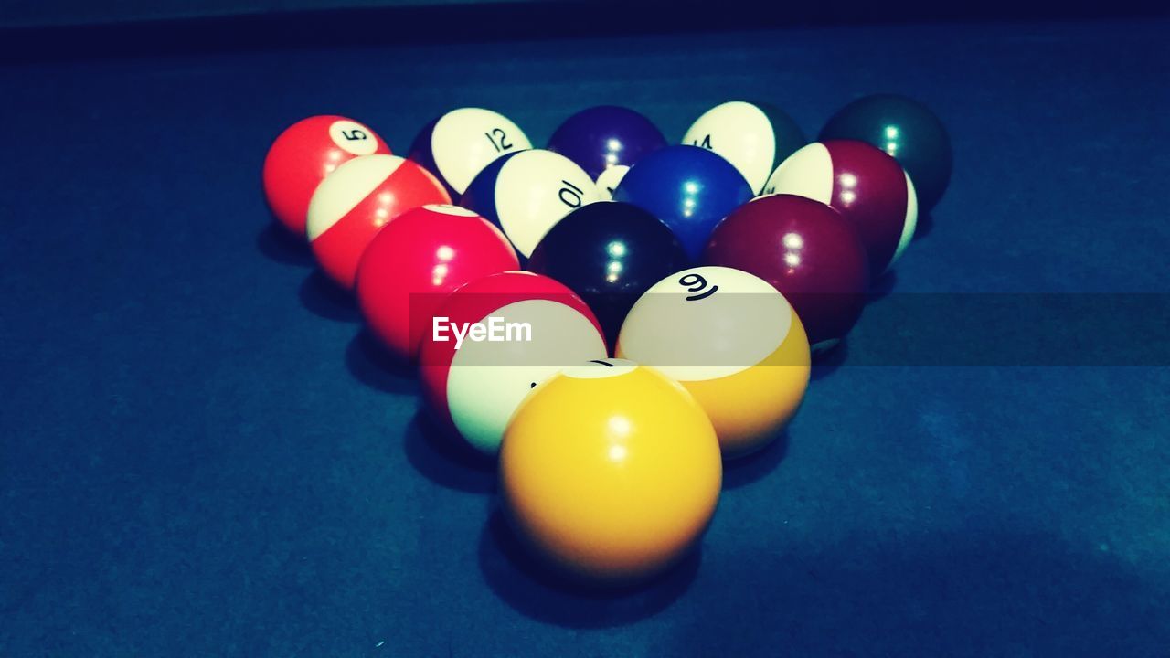 Bowling balls in formation on table