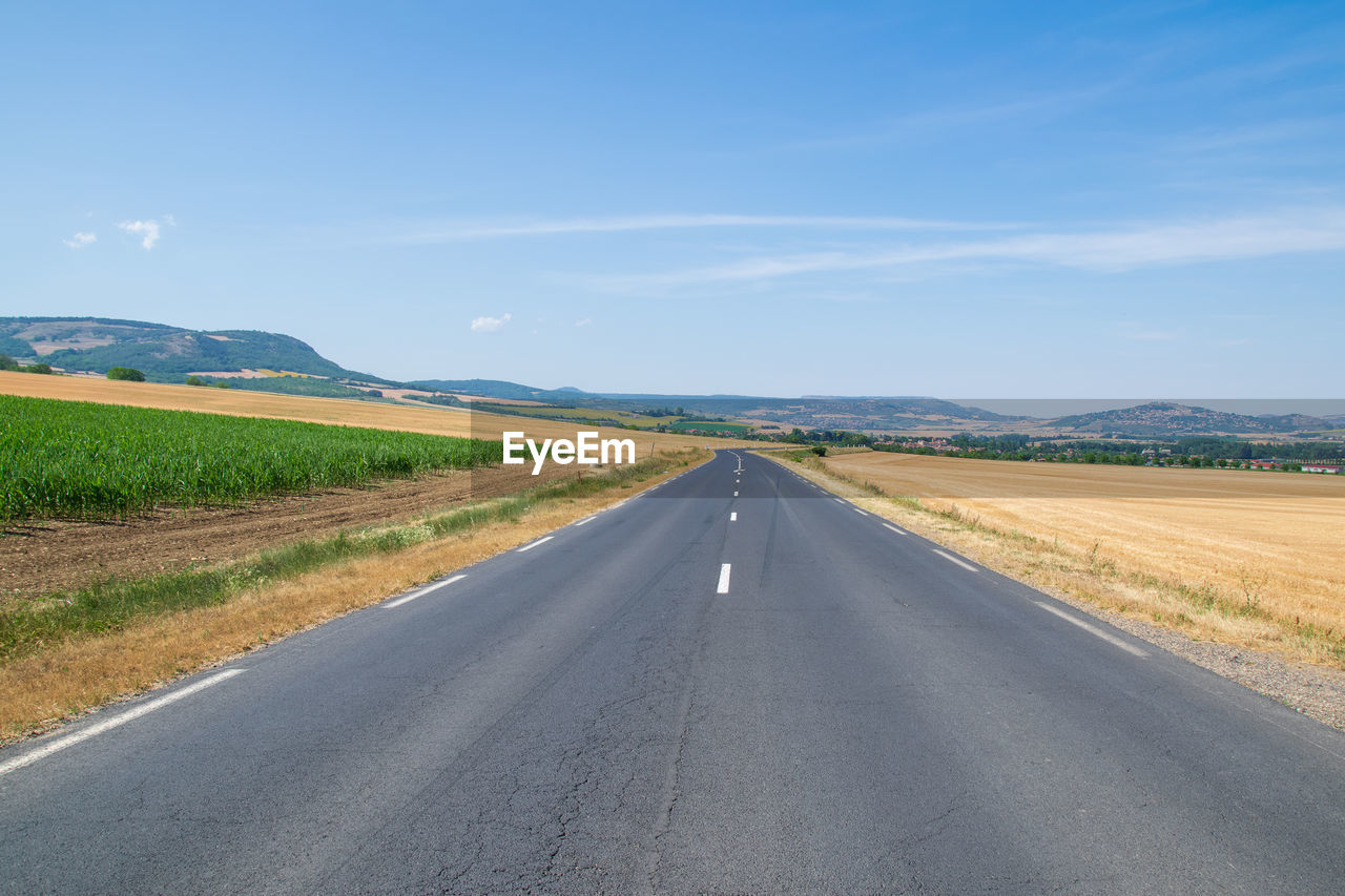 VIEW OF EMPTY ROAD ALONG LANDSCAPE