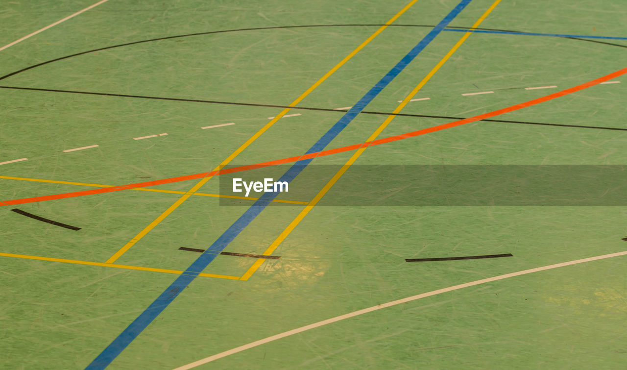 High angle view of dividing lines on floor at court