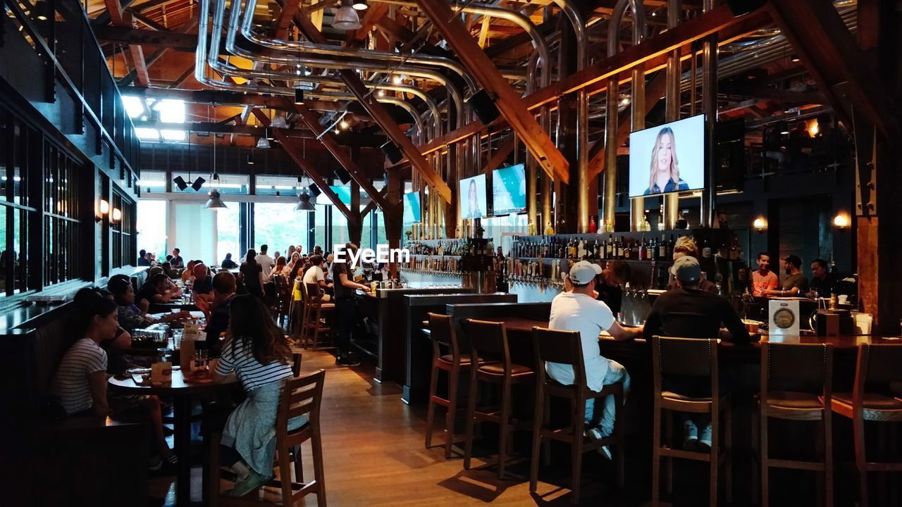 PEOPLE SITTING AT RESTAURANT