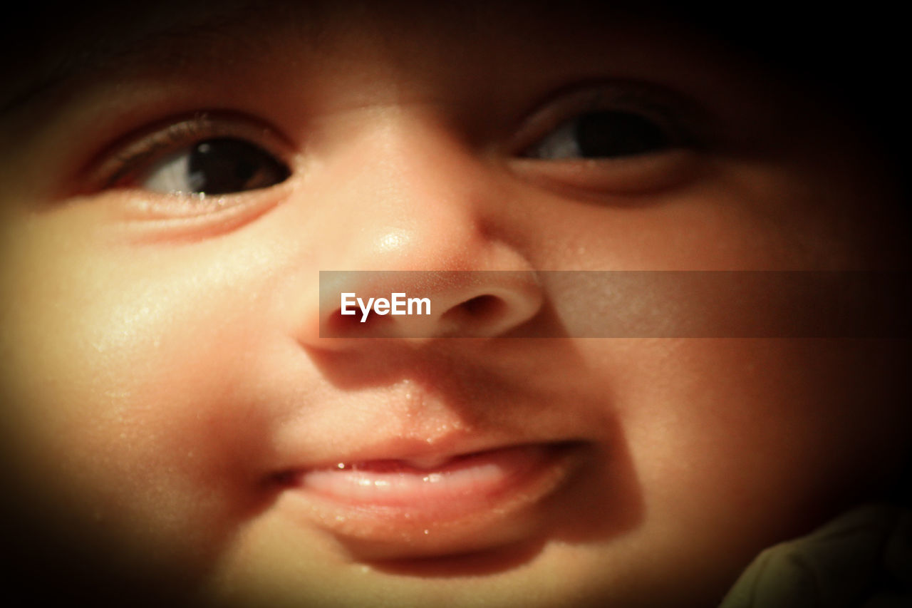 CLOSE-UP PORTRAIT OF BOY LOOKING AWAY