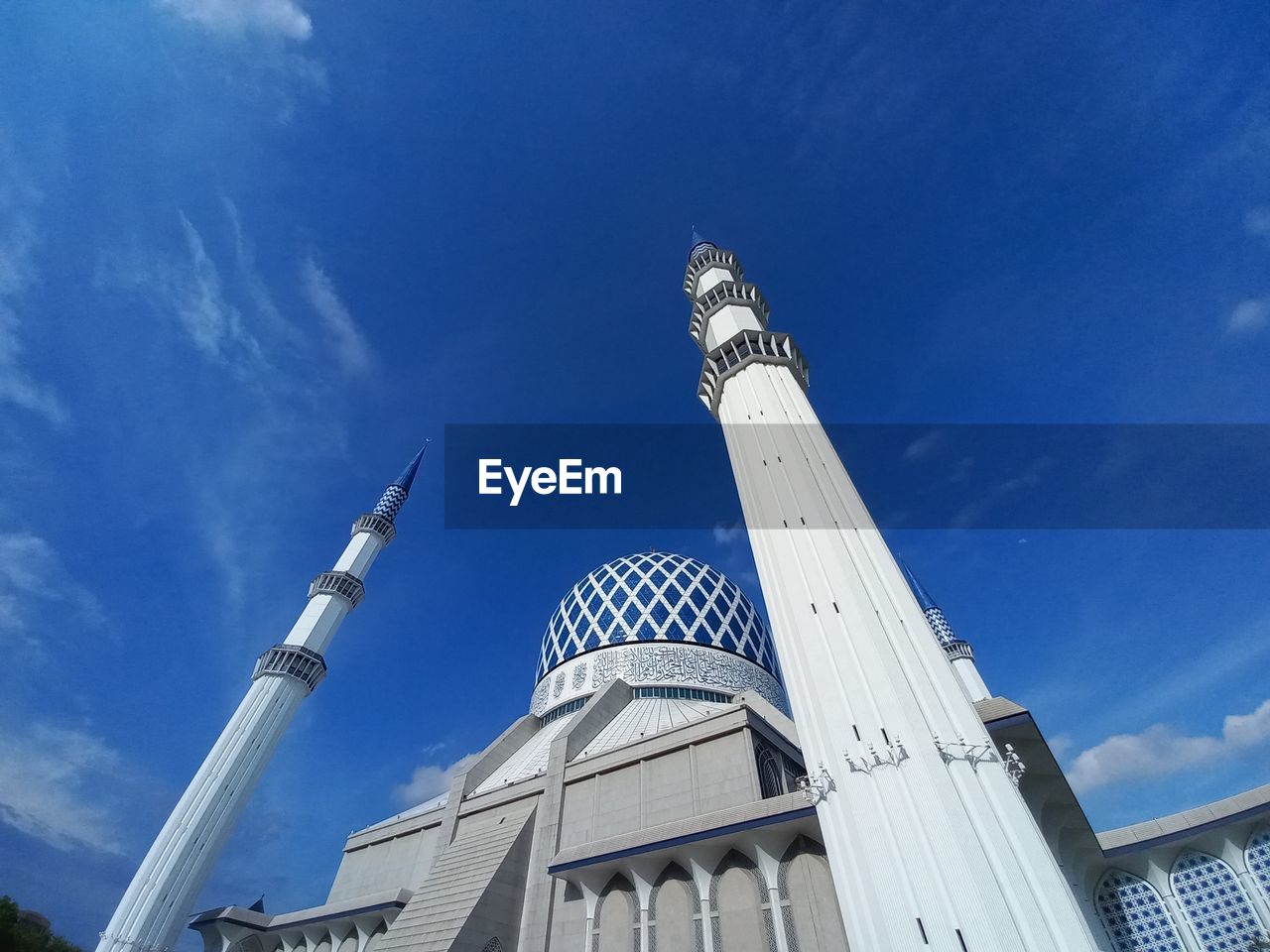 Shah alam mosque against blue sky