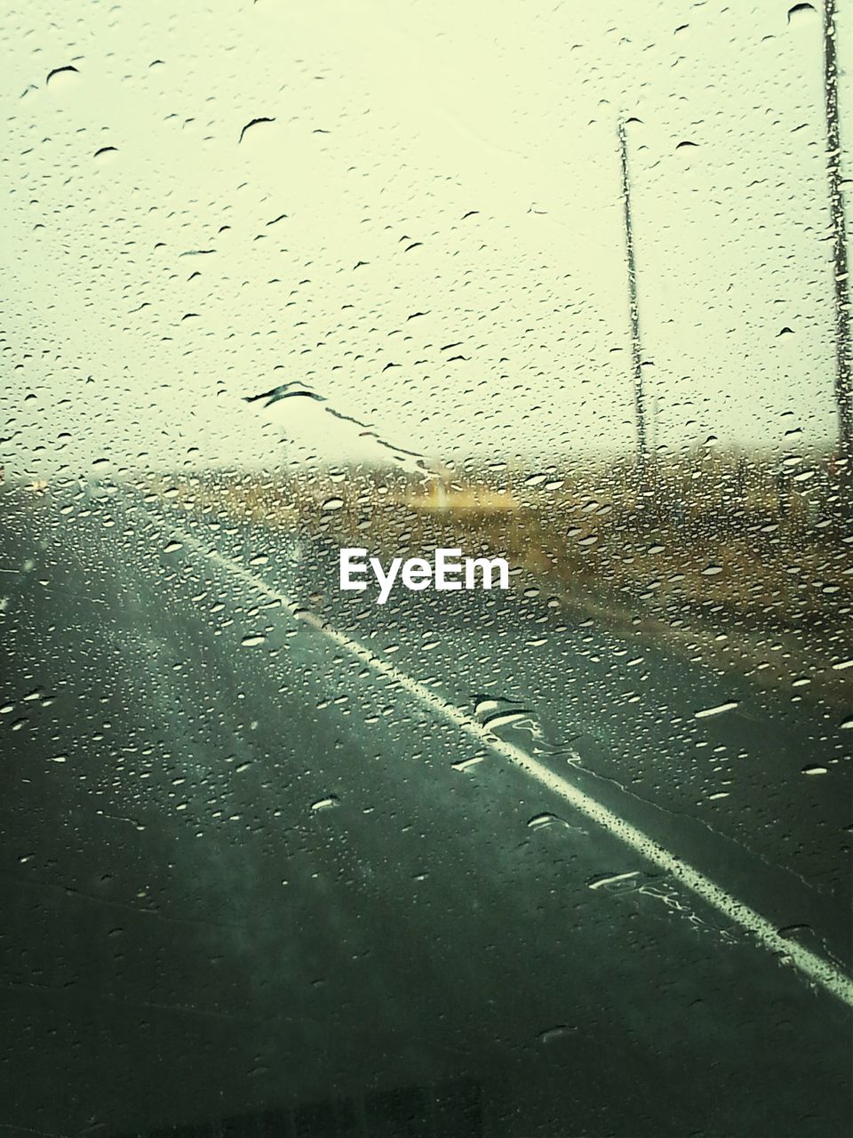 Road viewed through a window of a car