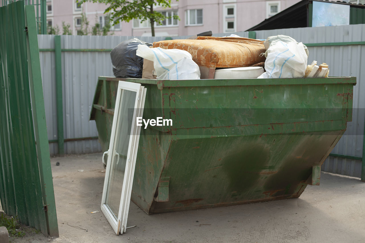 Garbage bin on the street. garbage container for trash. collection of waste in a container.