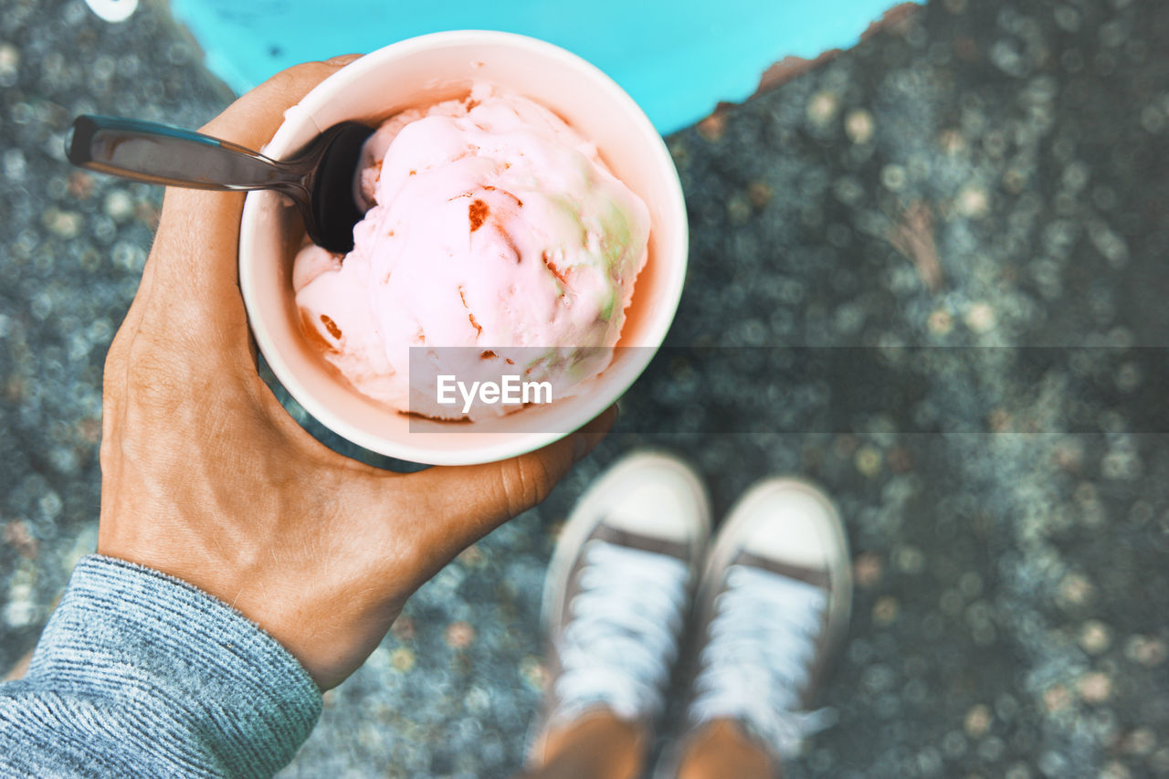 Low section of person holding ice cream