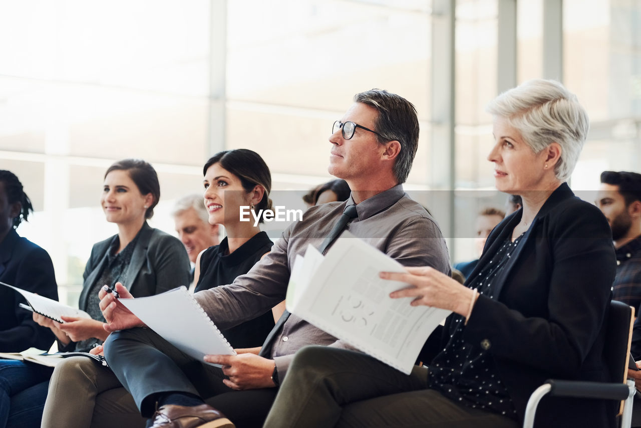 Group of people sitting in office