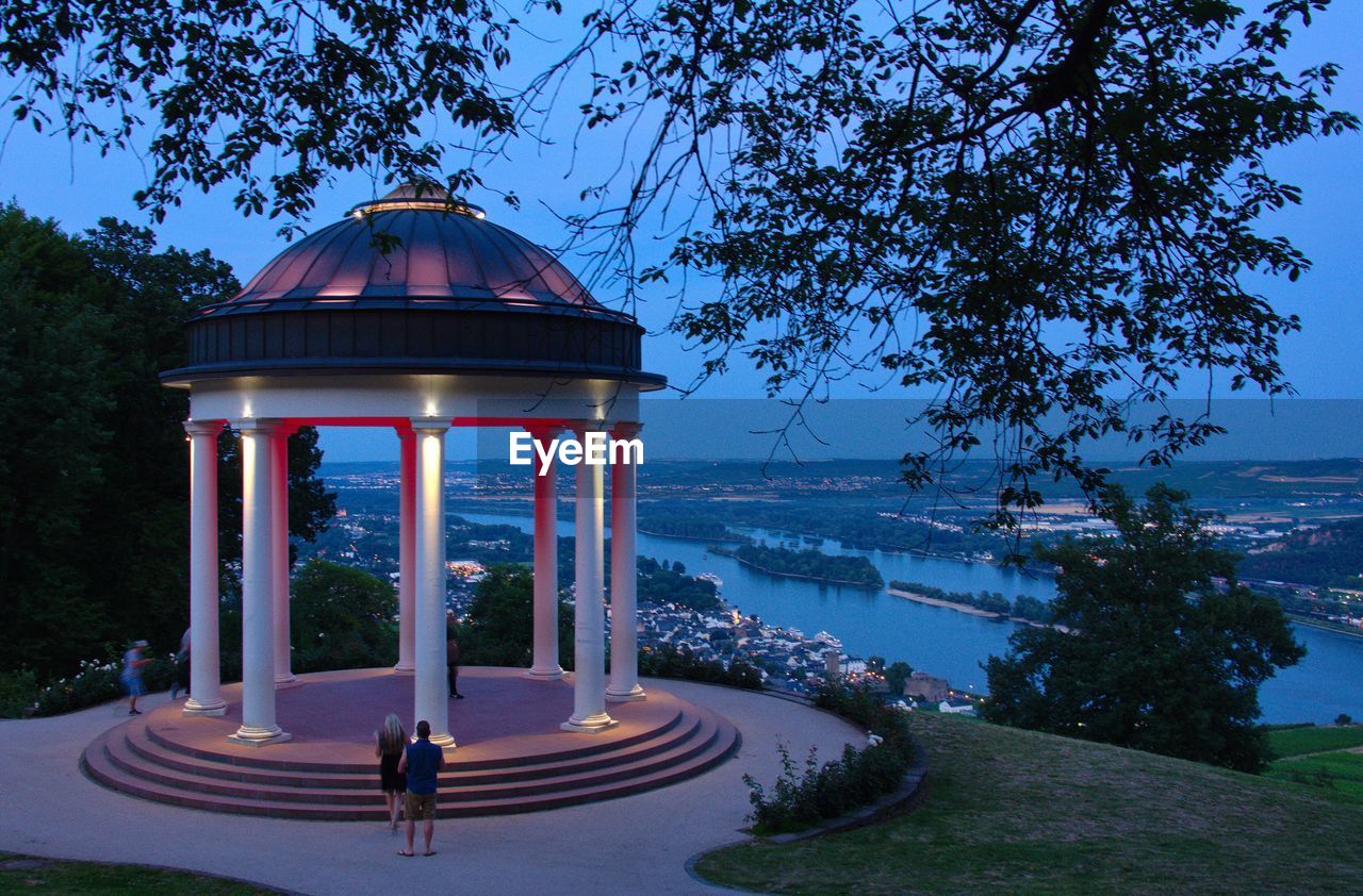 VIEW OF CITY LIT UP AT WATERFRONT