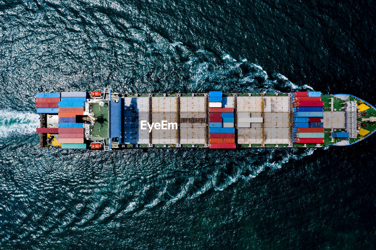 HIGH ANGLE VIEW OF CONTAINER SHIP ON SEA