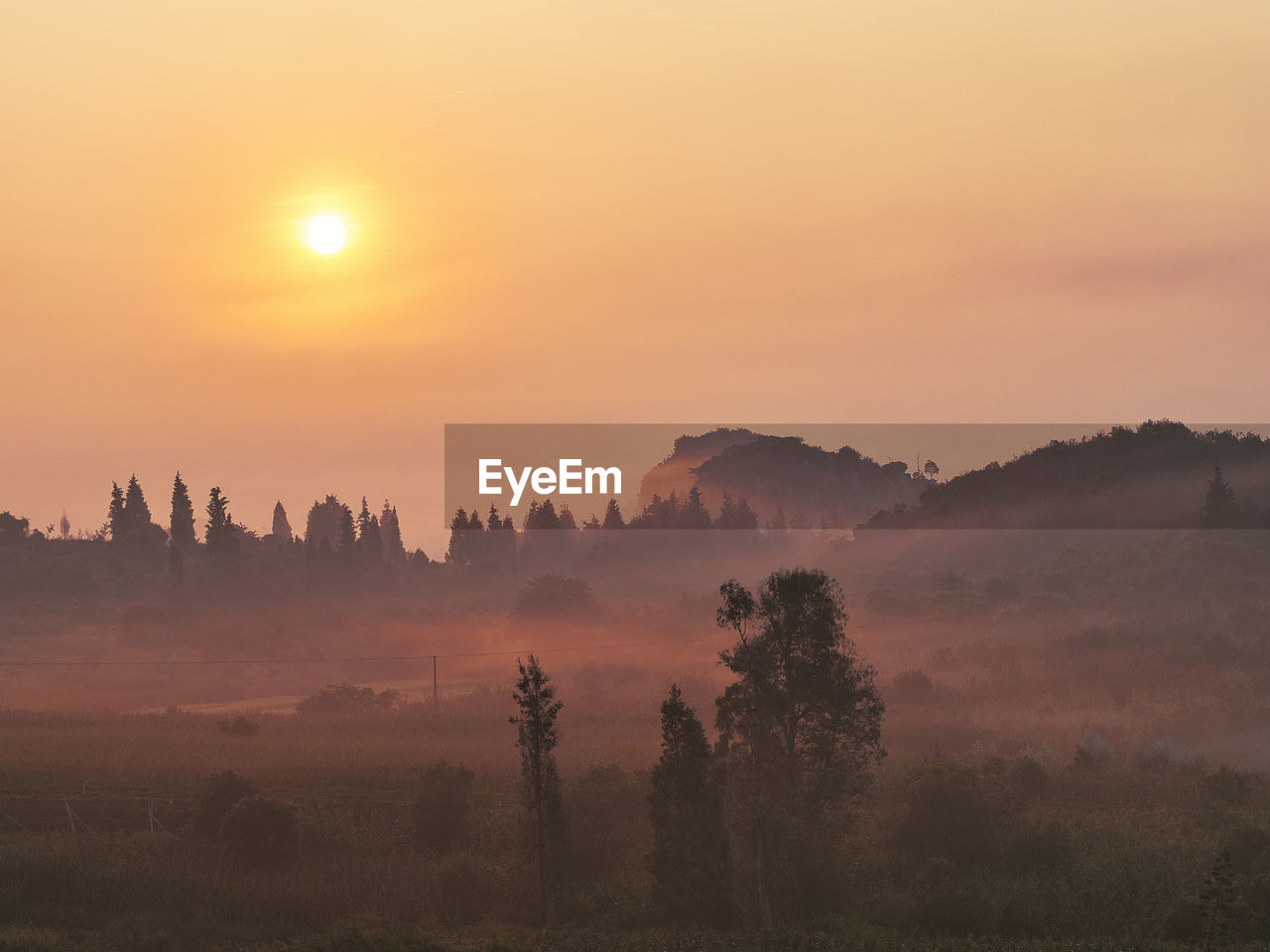 Scenic view of landscape against sky during sunset