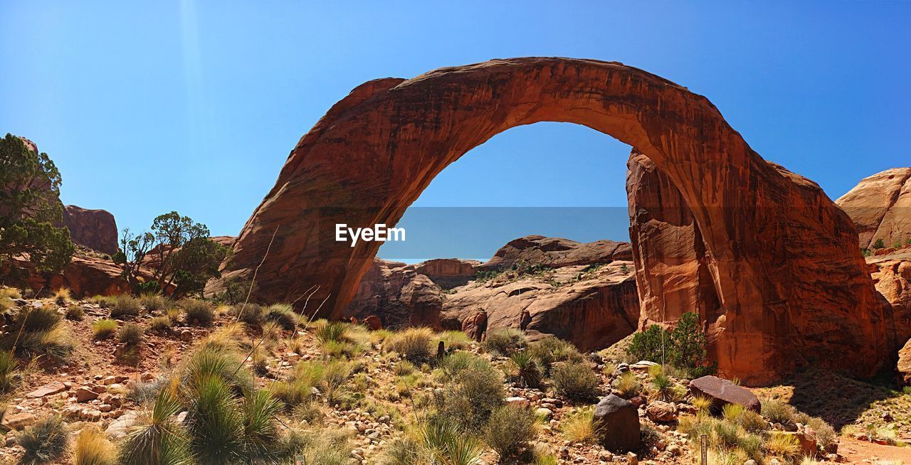 Rock formations on landscape against sky