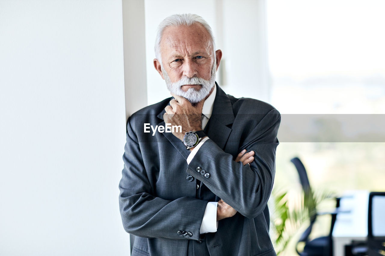 Portrait of businessman standing in office