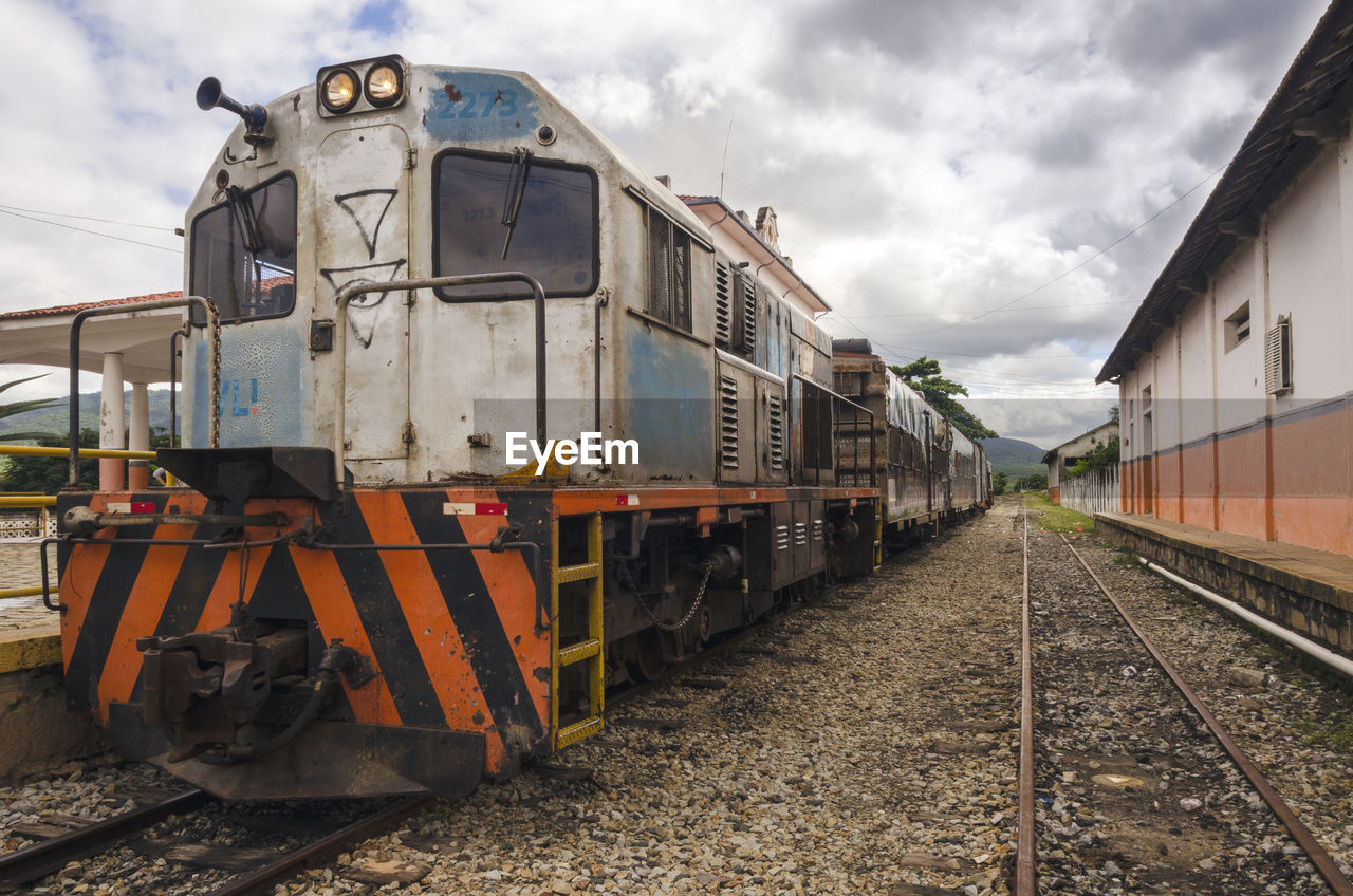 Train on railroad tracks against sky