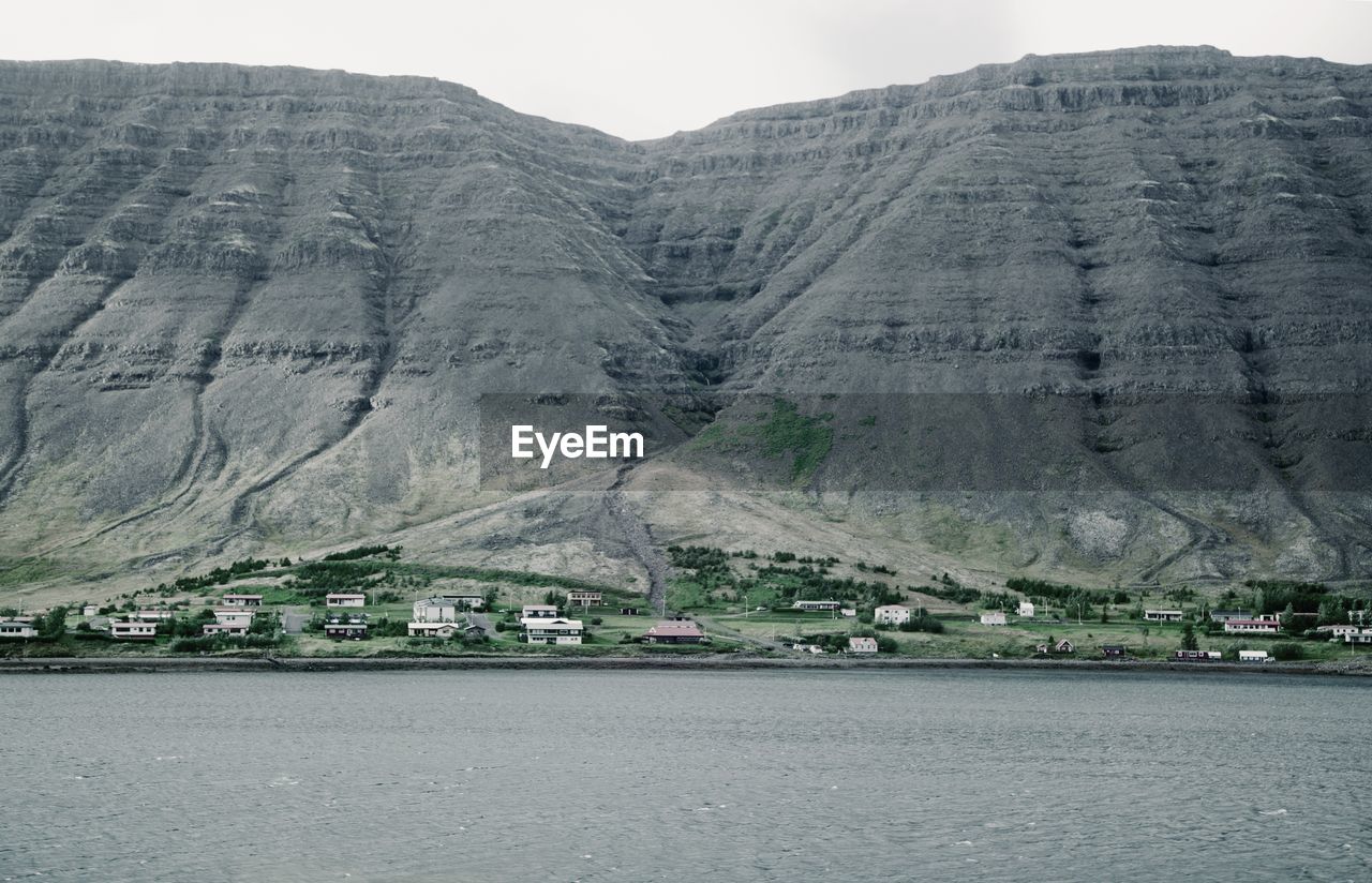 Scenic view of the small village on the mountain foot in the west fjord of iceland