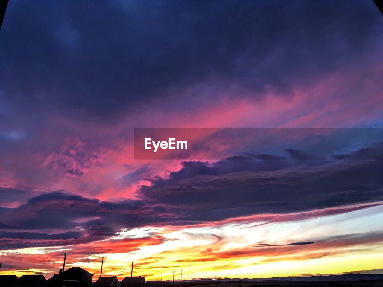 SCENIC VIEW OF DRAMATIC SKY DURING SUNSET