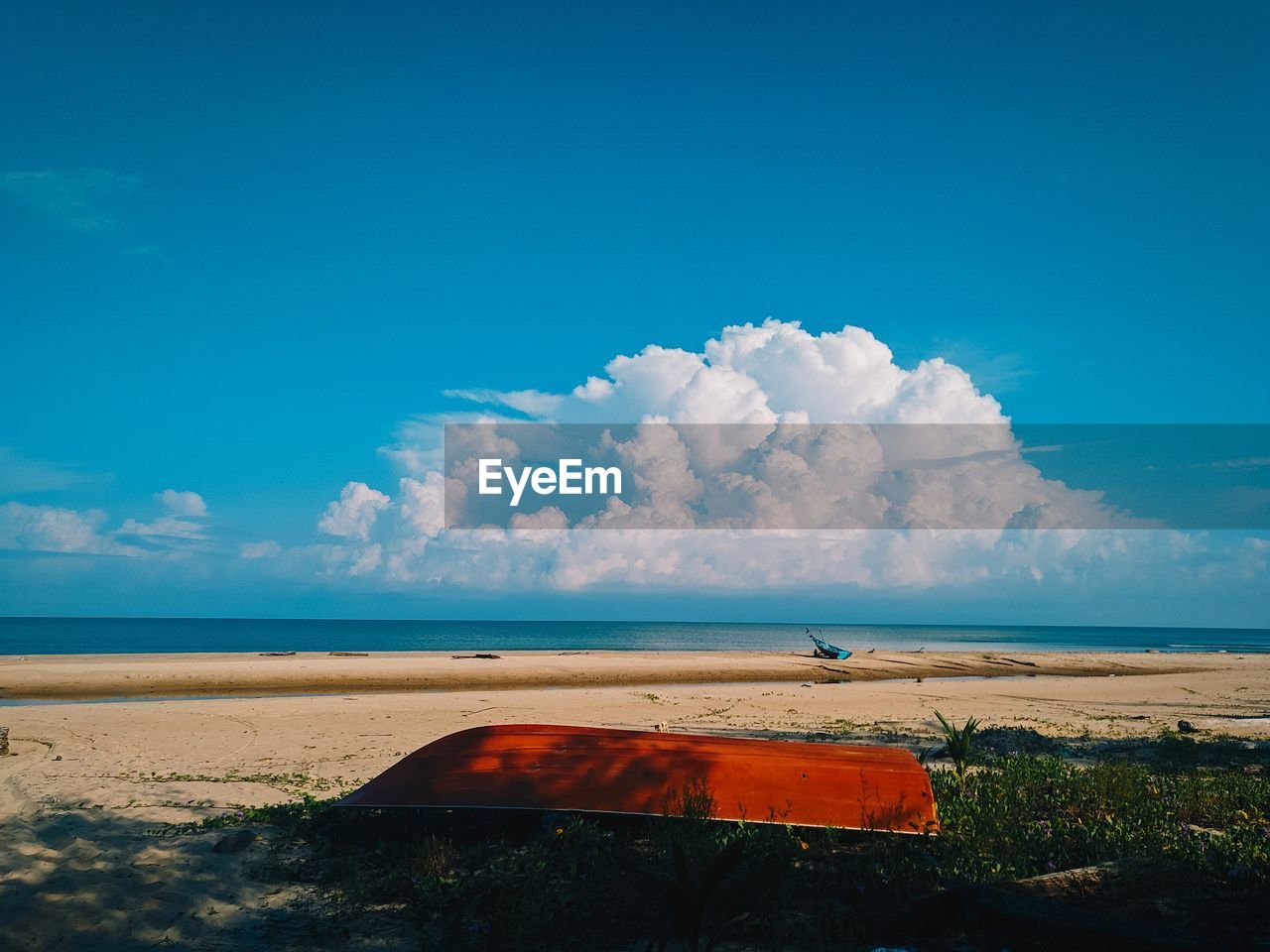 Scenic view of sea against blue sky