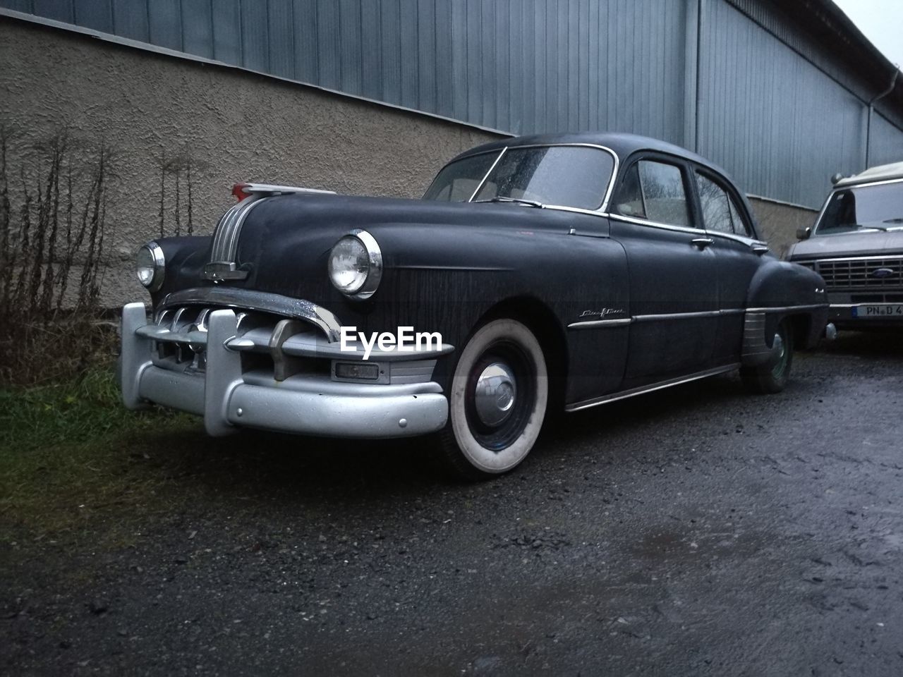 VINTAGE CAR ON TRUCK