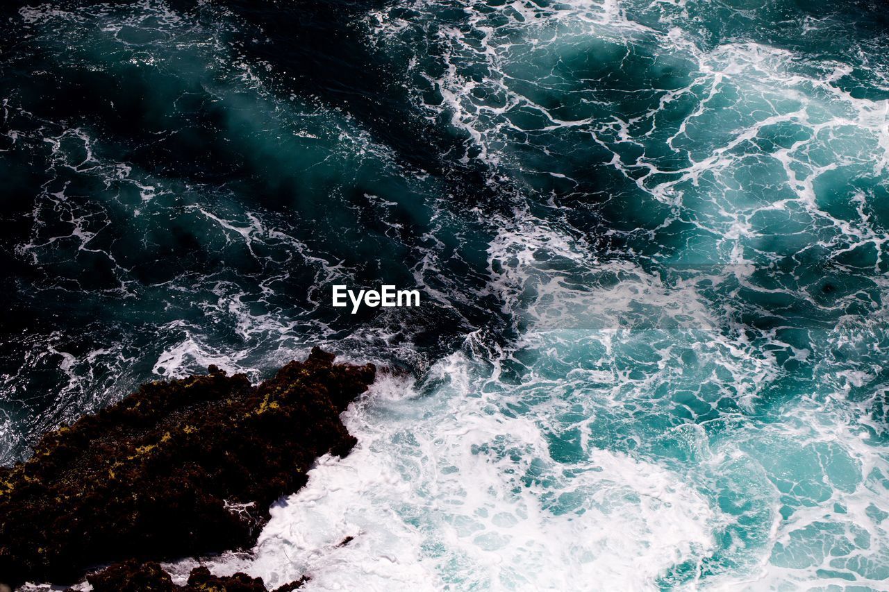 Full frame shot of rocks in sea