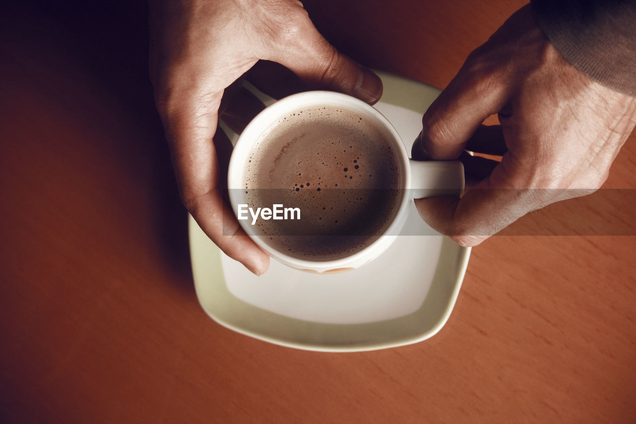 High angle view of coffee cup on table