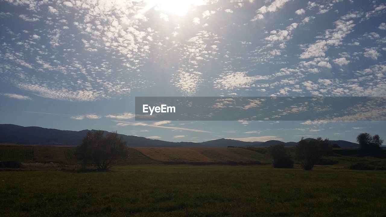 SCENIC VIEW OF LANDSCAPE AGAINST CLOUDY SKY