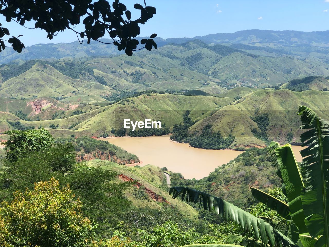 Scenic view of landscape and mountains against sky