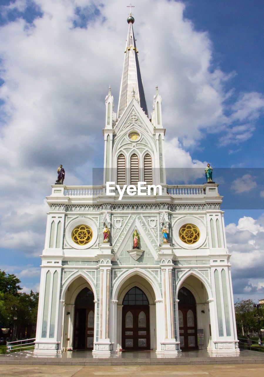 Low angle view of church against cloudy sky