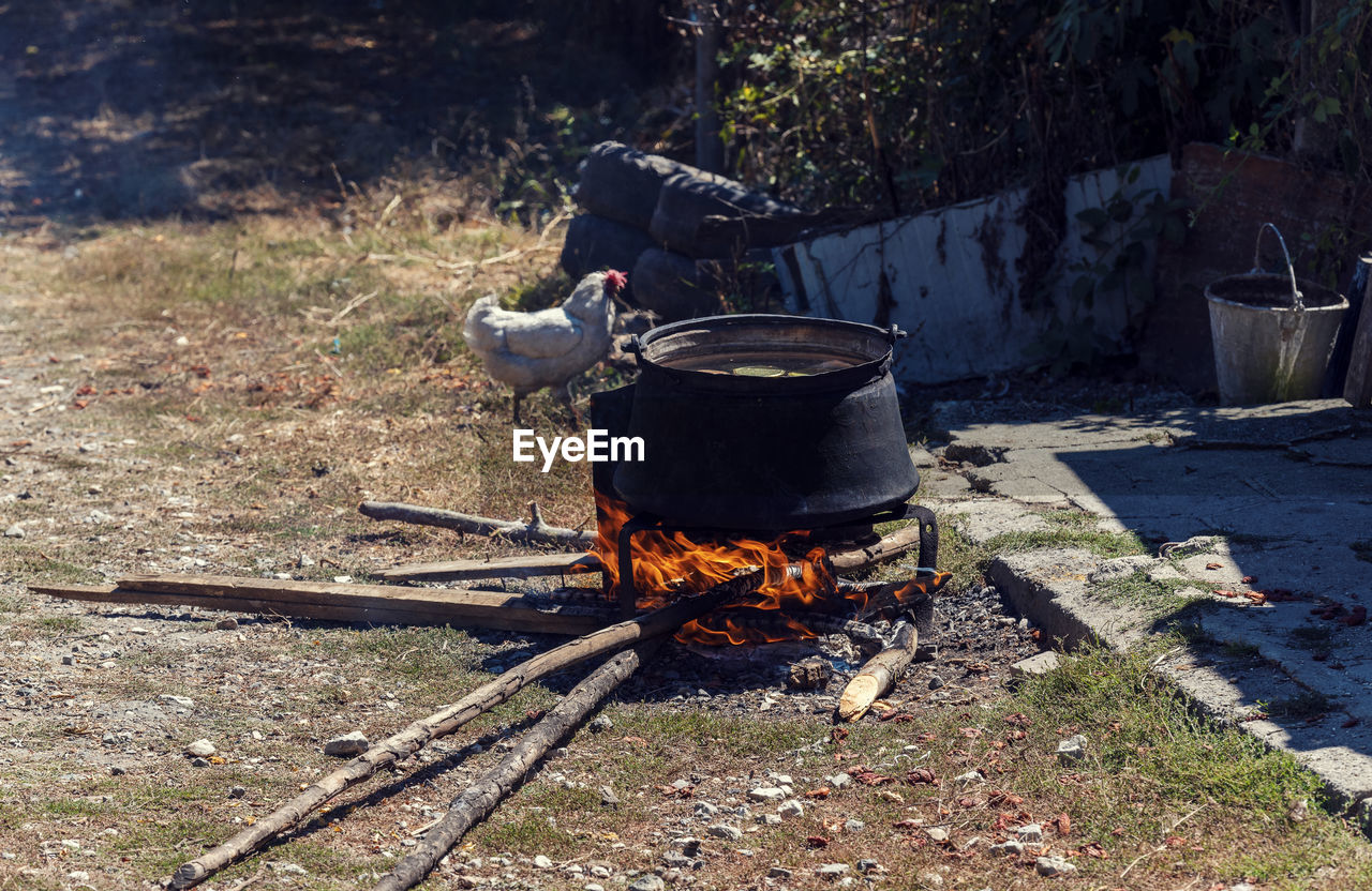 HIGH ANGLE VIEW OF FIRE ON GRILL