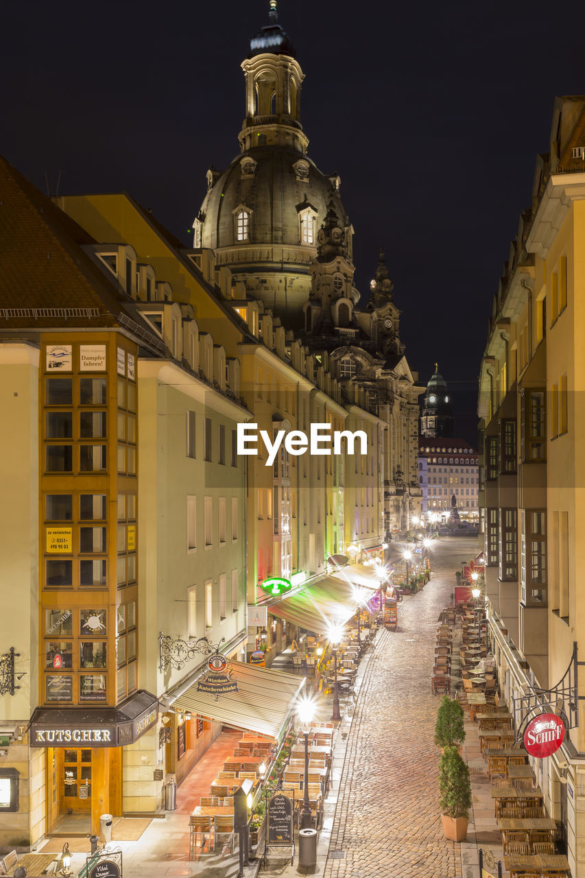 Illuminated buildings in city at night