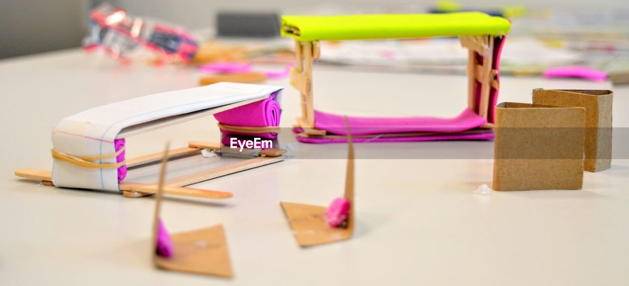 Close-up of multi colored glasses on table