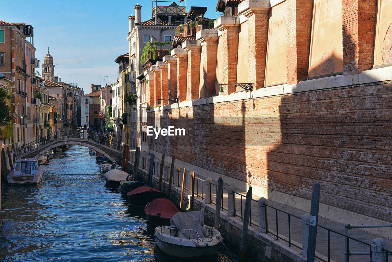 Canal amidst buildings in city