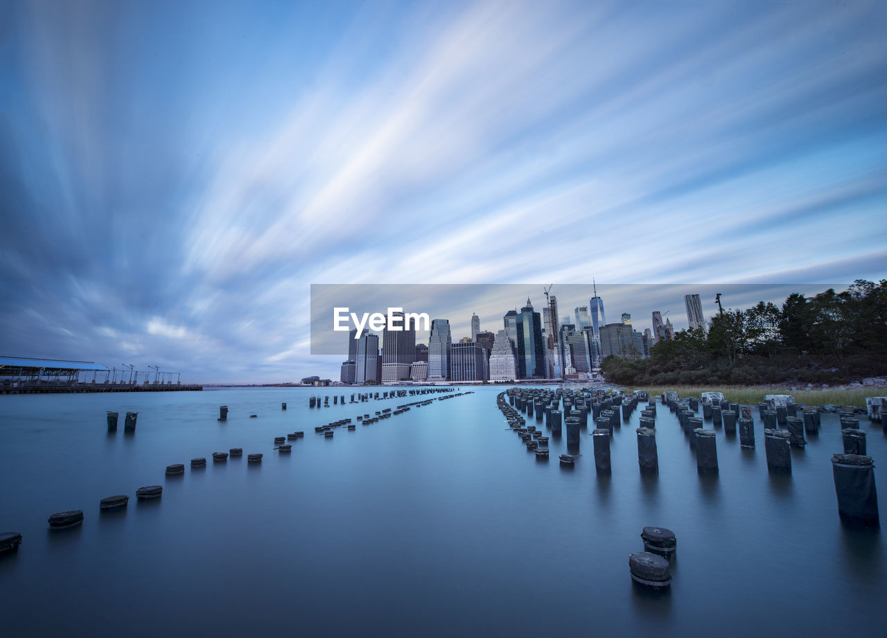 Manhattan glows across east river nyc