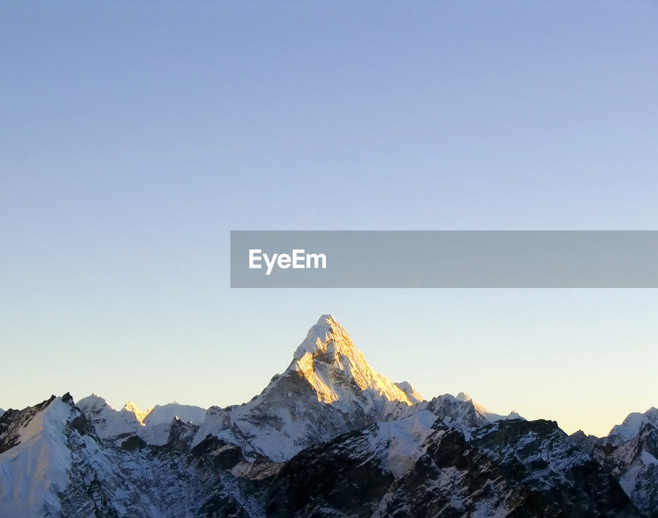 Snow capped peak ama dablam in the himalaya, nepal.