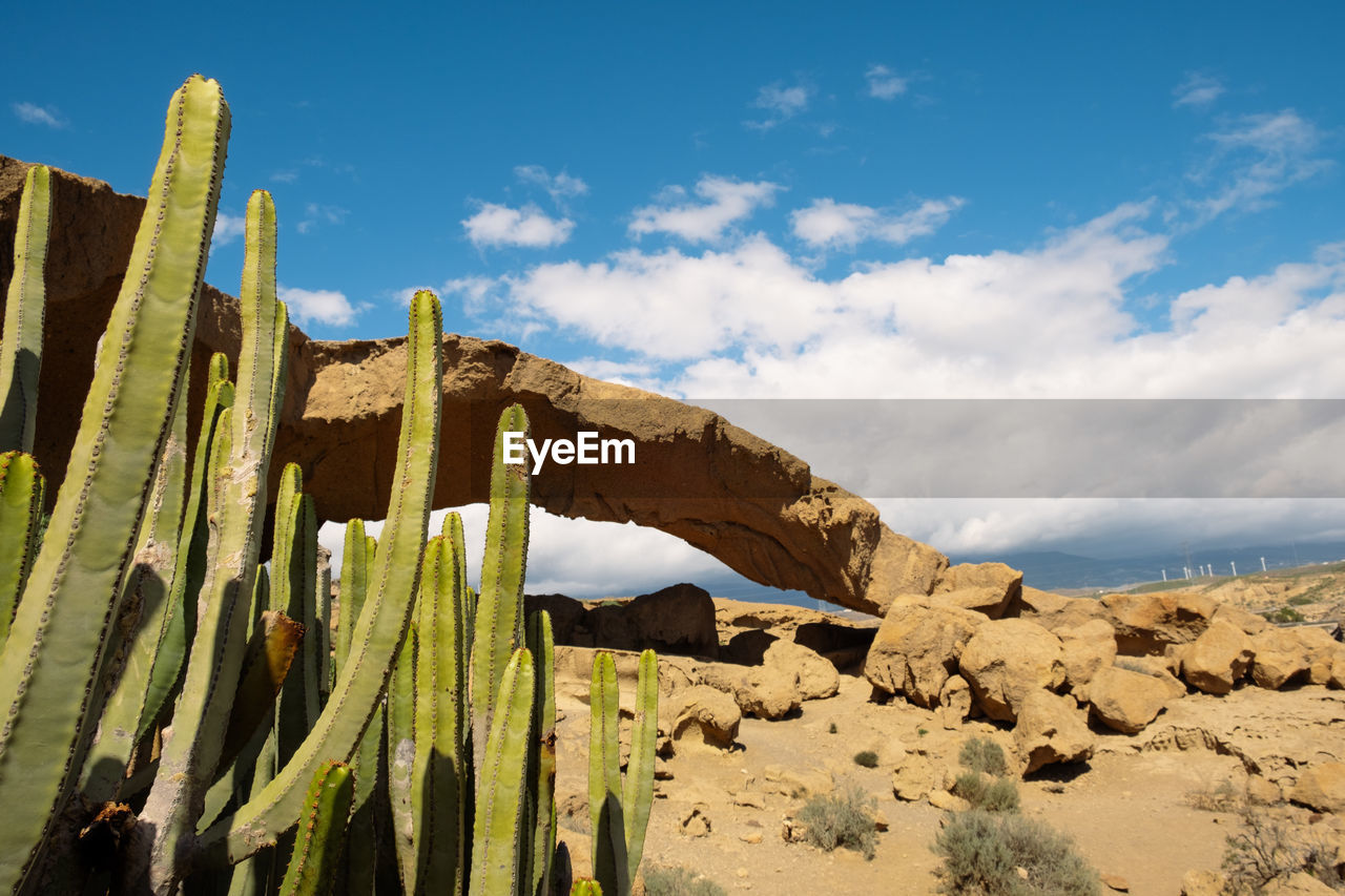 low angle view of rock formations against sky