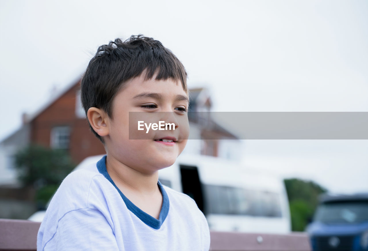 Close-up of boy looking away