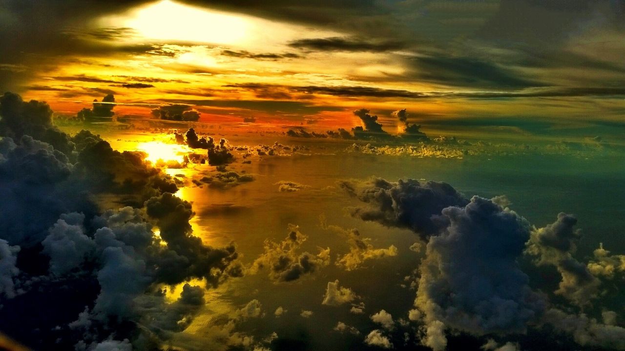 High angle view of clouds over sea at sunset