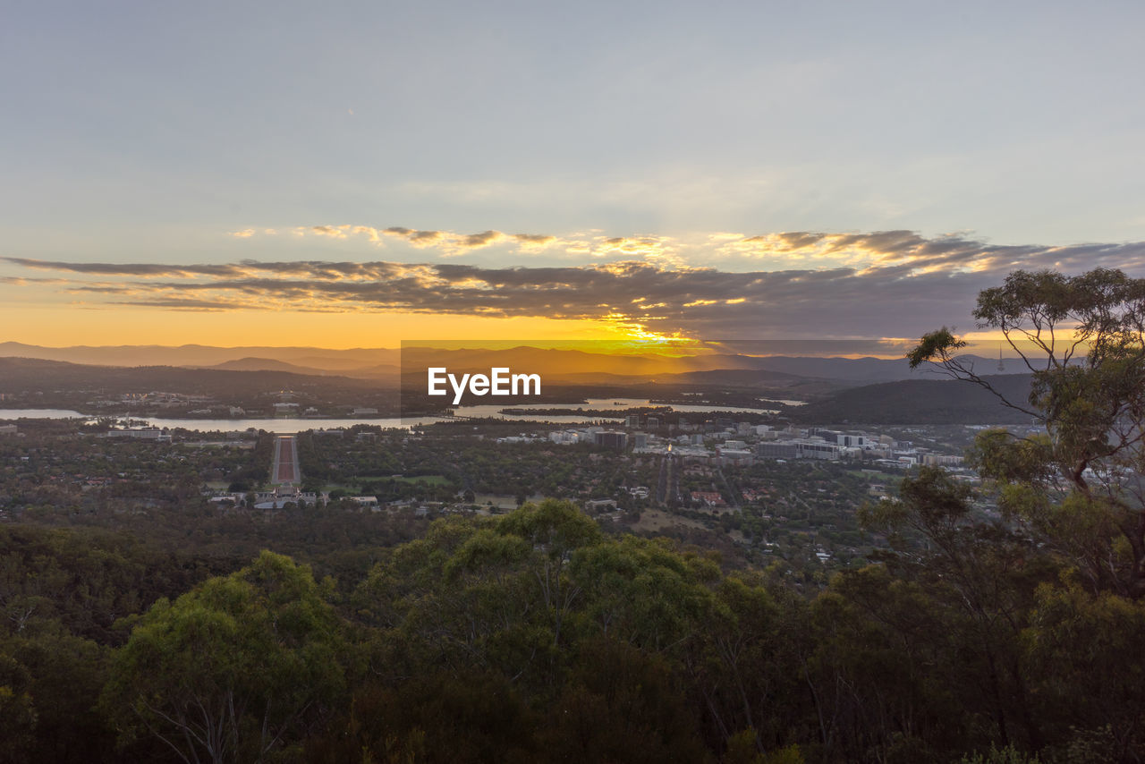 Scenic view of landscape against sky during sunset