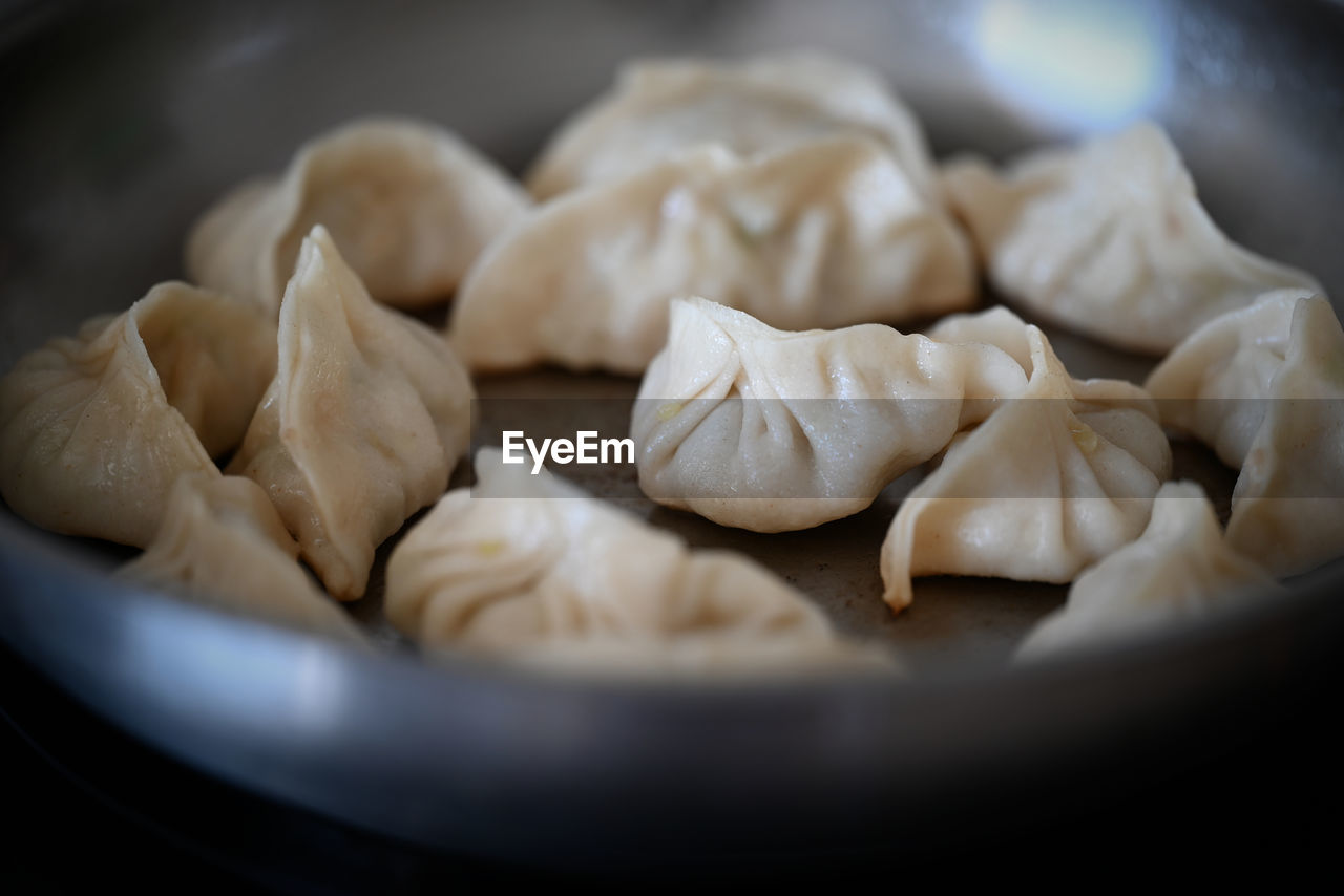 Close-up of fried dumplings in a pan
