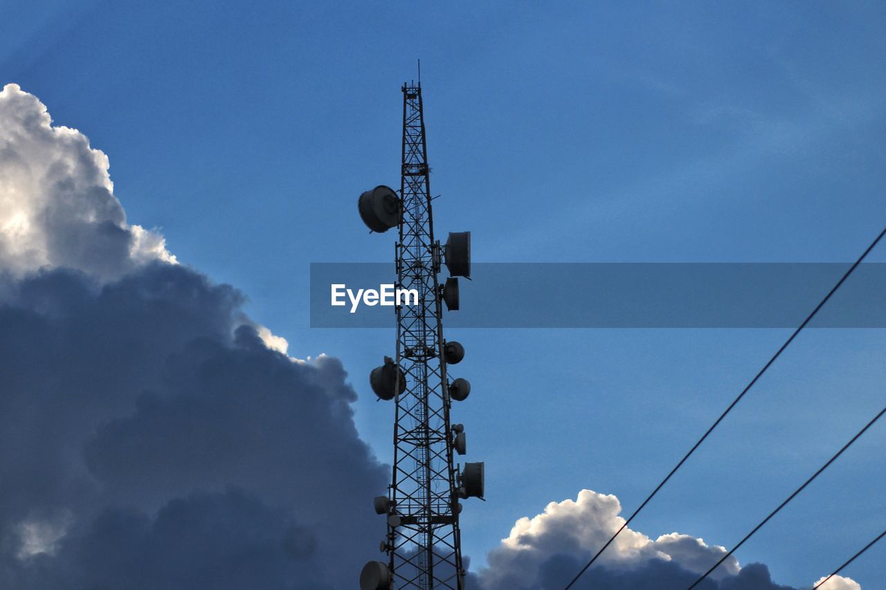 Low angle view of communications tower against sky