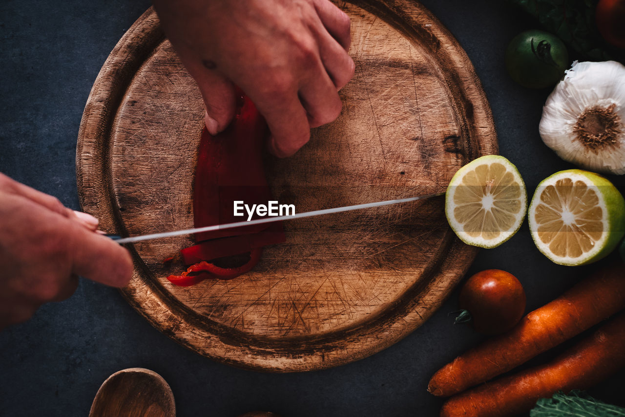 Close-up of man preparing food on table