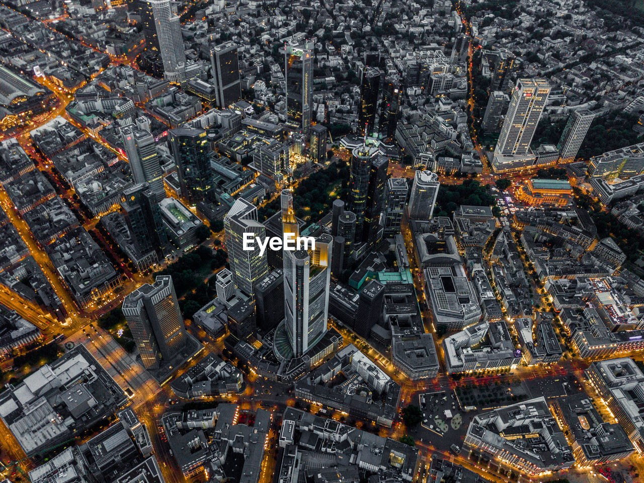 Aerial overhead shot of frankfurt am main, germany skyline at night with glowing streets