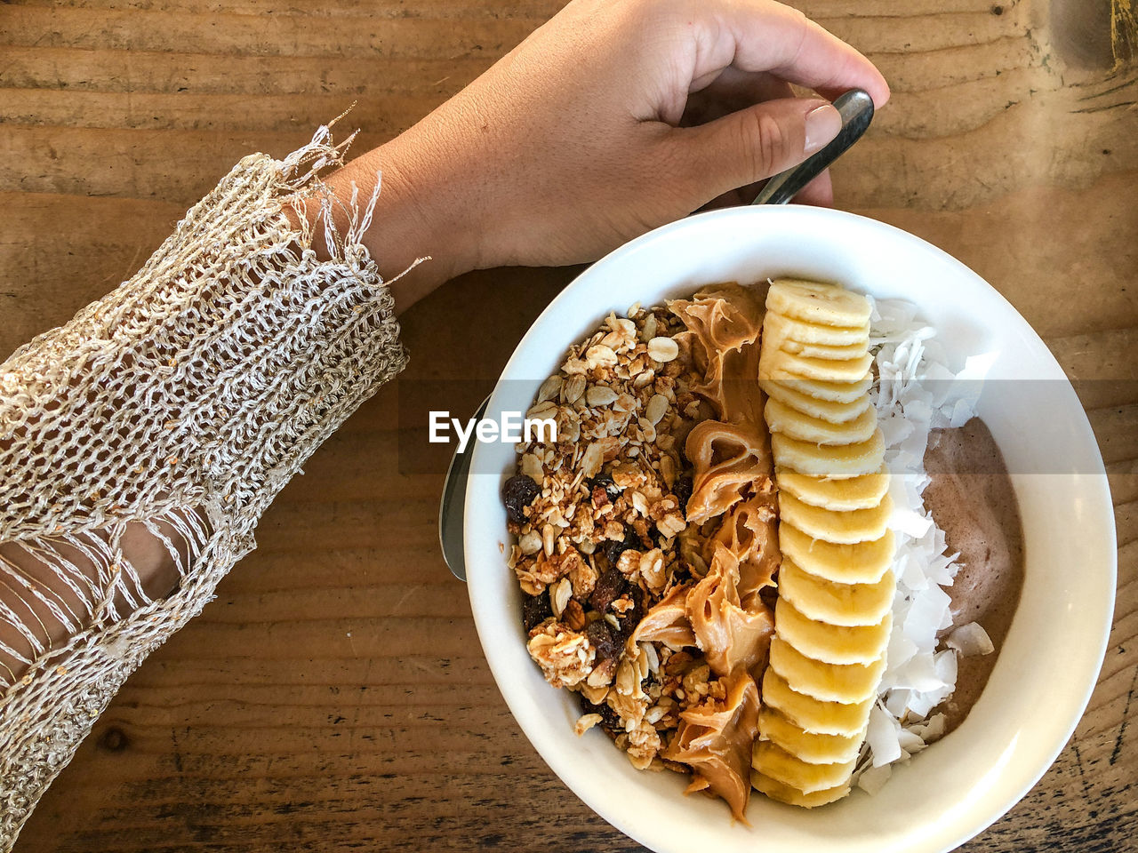 High angle view of woman holding smoothie bowl