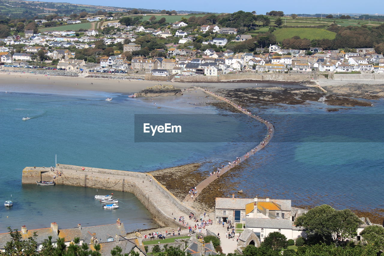 HIGH ANGLE VIEW OF SEA AND CITYSCAPE