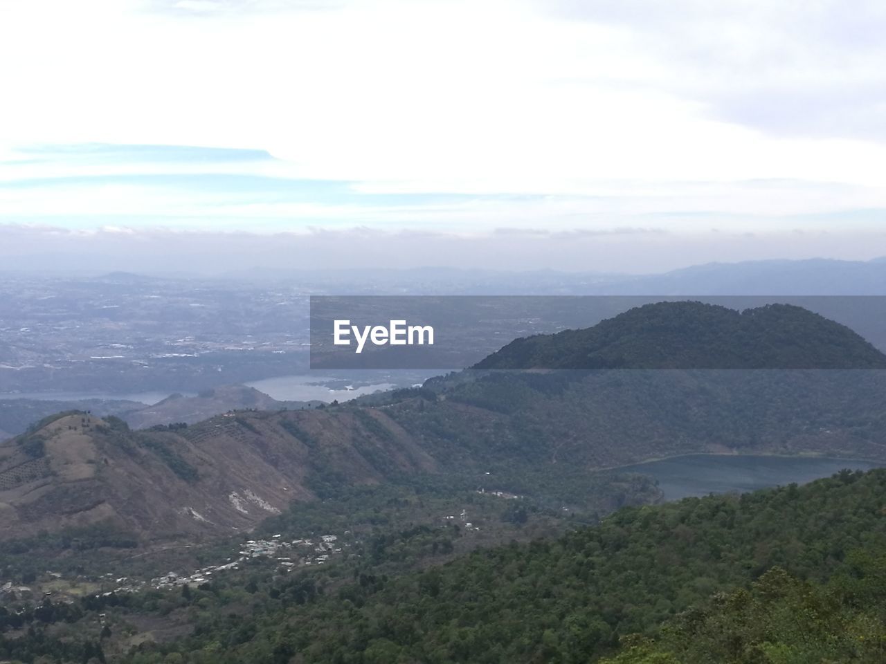 SCENIC VIEW OF TREE MOUNTAINS AGAINST SKY