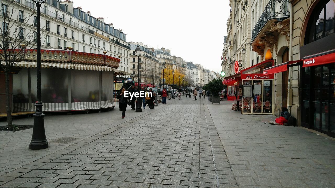 PEOPLE WALKING ON A STREET