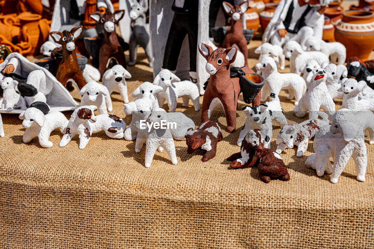 large group of objects, representation, dog, no people, animal representation, abundance, market, mammal, for sale, tradition, toy, animal, creativity, day, retail, celebration, high angle view, christmas, holiday, still life, human representation