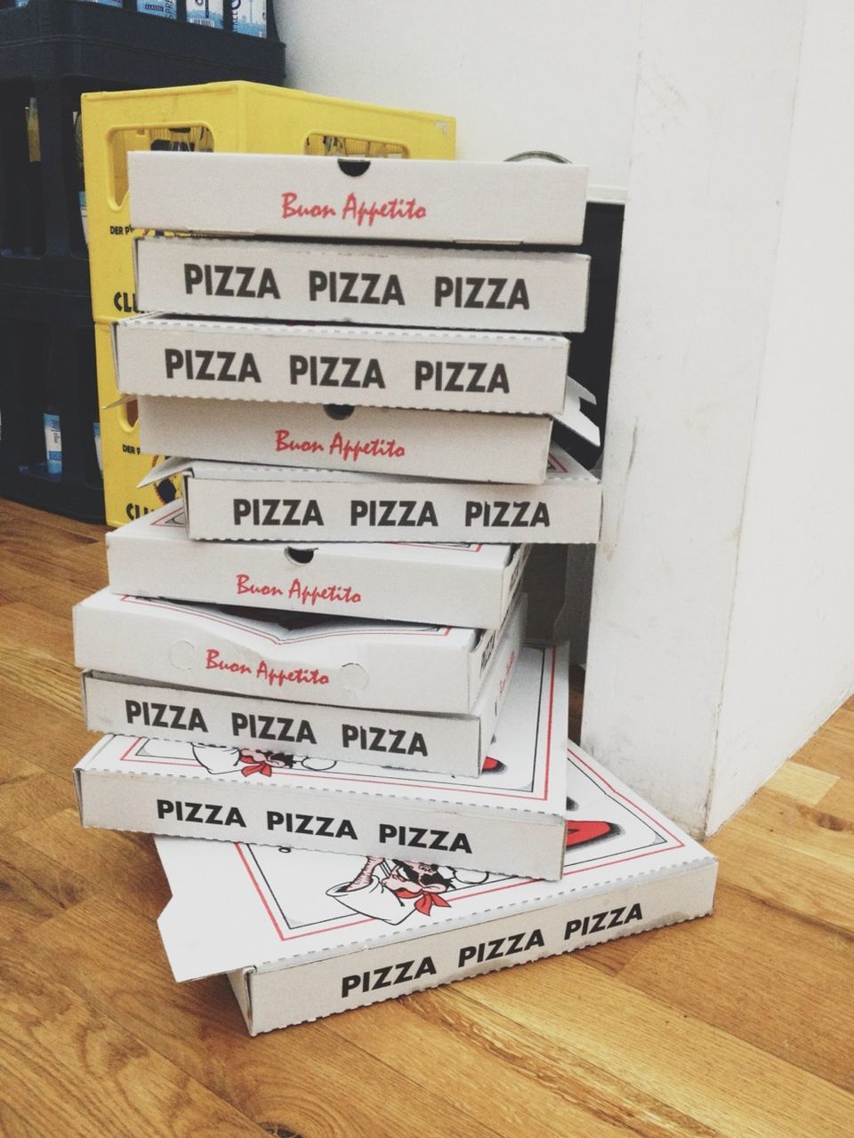 Stack of pizza boxes at home