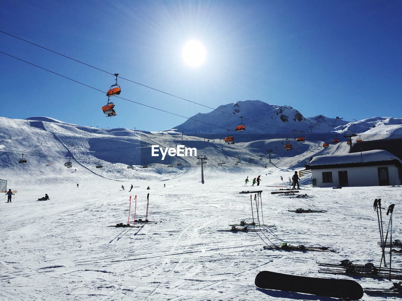 People skiing on snow covered landscape